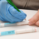 DNA evidence collection tubes lie on a table during a wide-spread DNA testing in Goehren on the island of Ruegen, Germany.